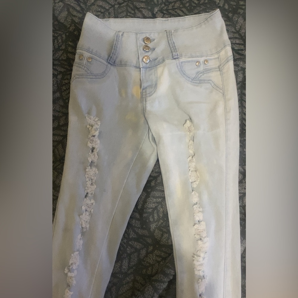 Woman’s small, worn only a couple of times, light blue jeans.